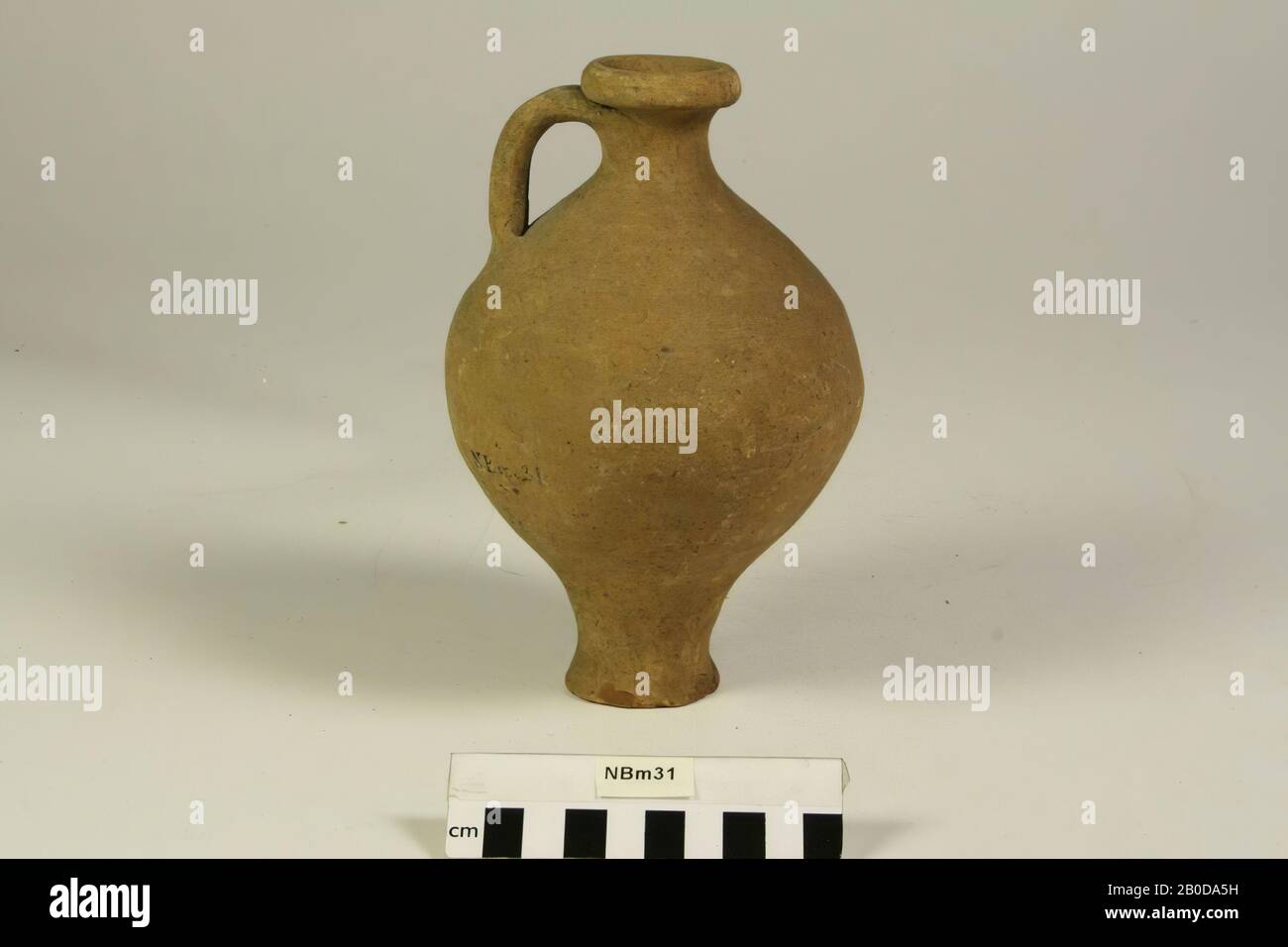 Can with 1 ear on narrow foot. Slight damage at foot, can, pottery, h: 19 cm, diam: 11.5 cm, Germany Stock Photo