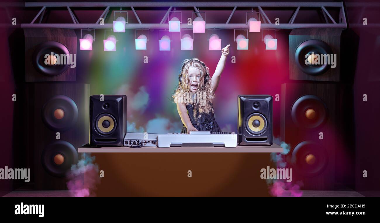 a gradeschooler girl as DJ at the kids disco Stock Photo