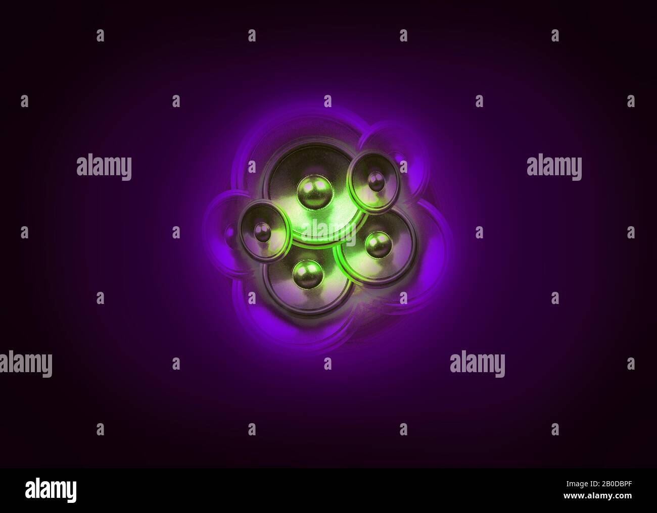 Green audio speakers on a dark purple background with vignette Stock Photo