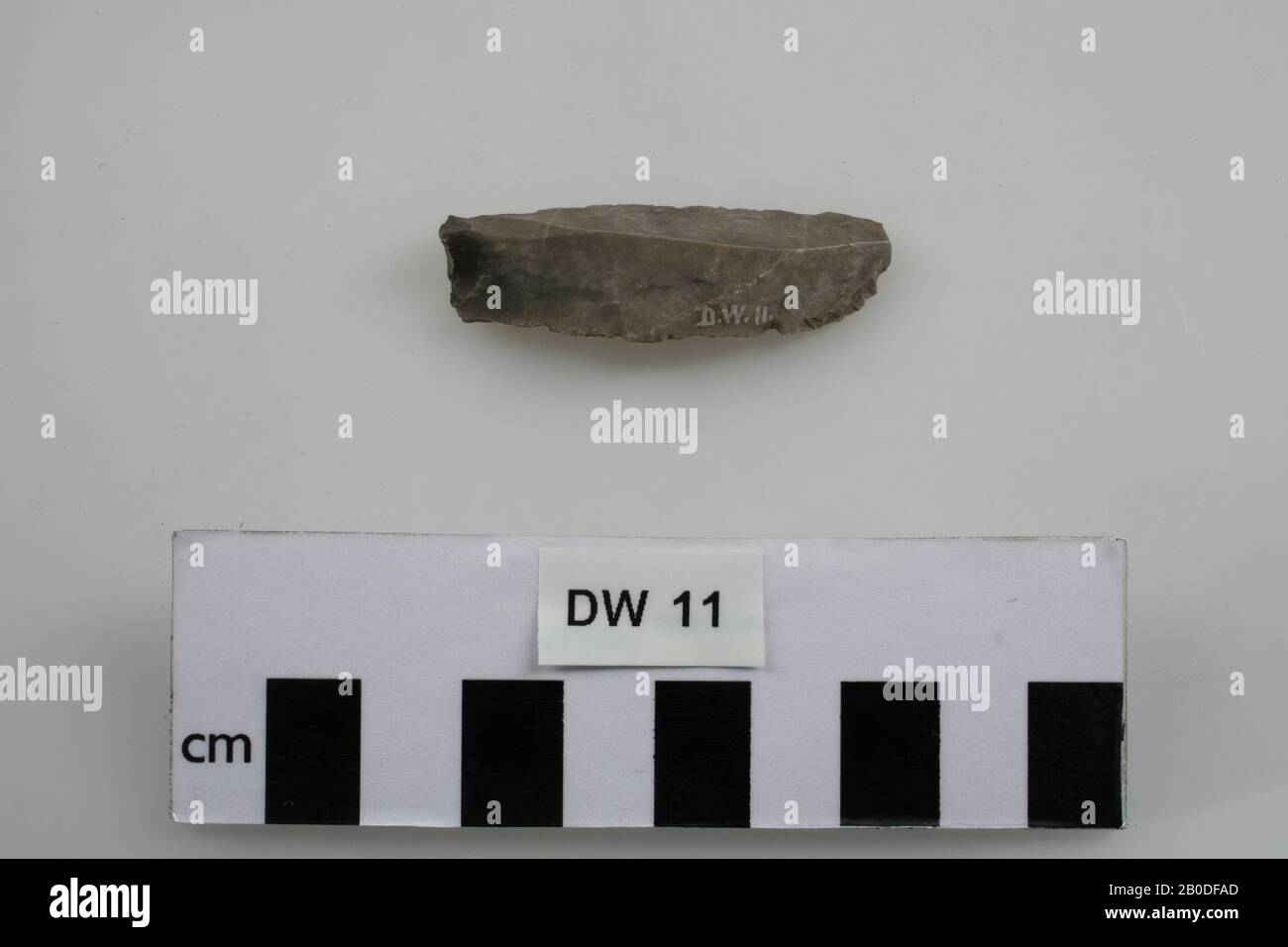 Narrow, thin flint stone tool., Tool, stone, flint, 0.5 x 2 x 5.5 cm, prehistory, Denmark, Sjaeland, unknown, unknown Stock Photo