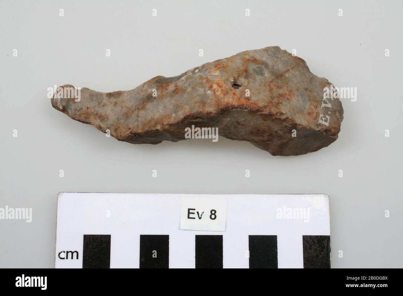 Three-sided piece of flint, S-shaped, with a wide and narrow end, fragment, stone, flint, 2 x 4 x 11 cm, prehistory, Belgium, unknown, unknown, Spiennes Stock Photo