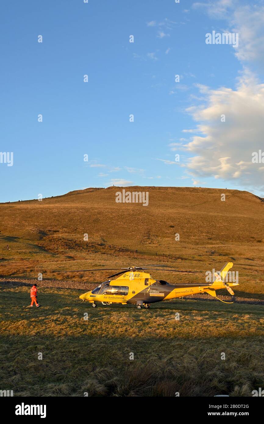 Rescue helicopter landing in Peak District Derbyshire England Stock Photo