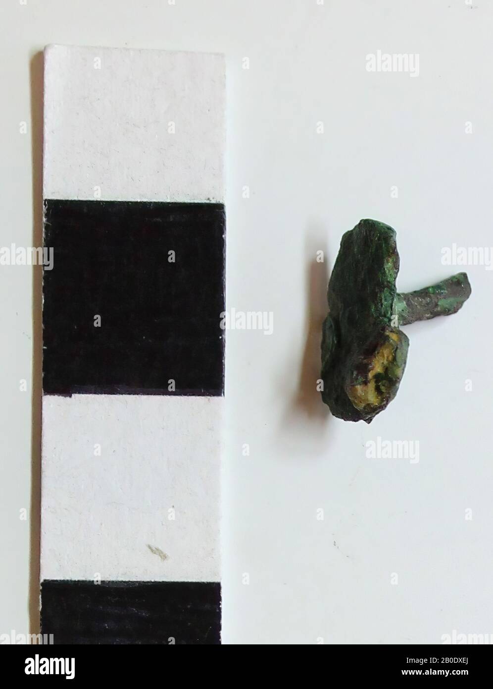 Old Europe, belt tongue, metal, bronze, 1.0 x 0.6 x 0.7 cm, Location, France, Amiens Stock Photo
