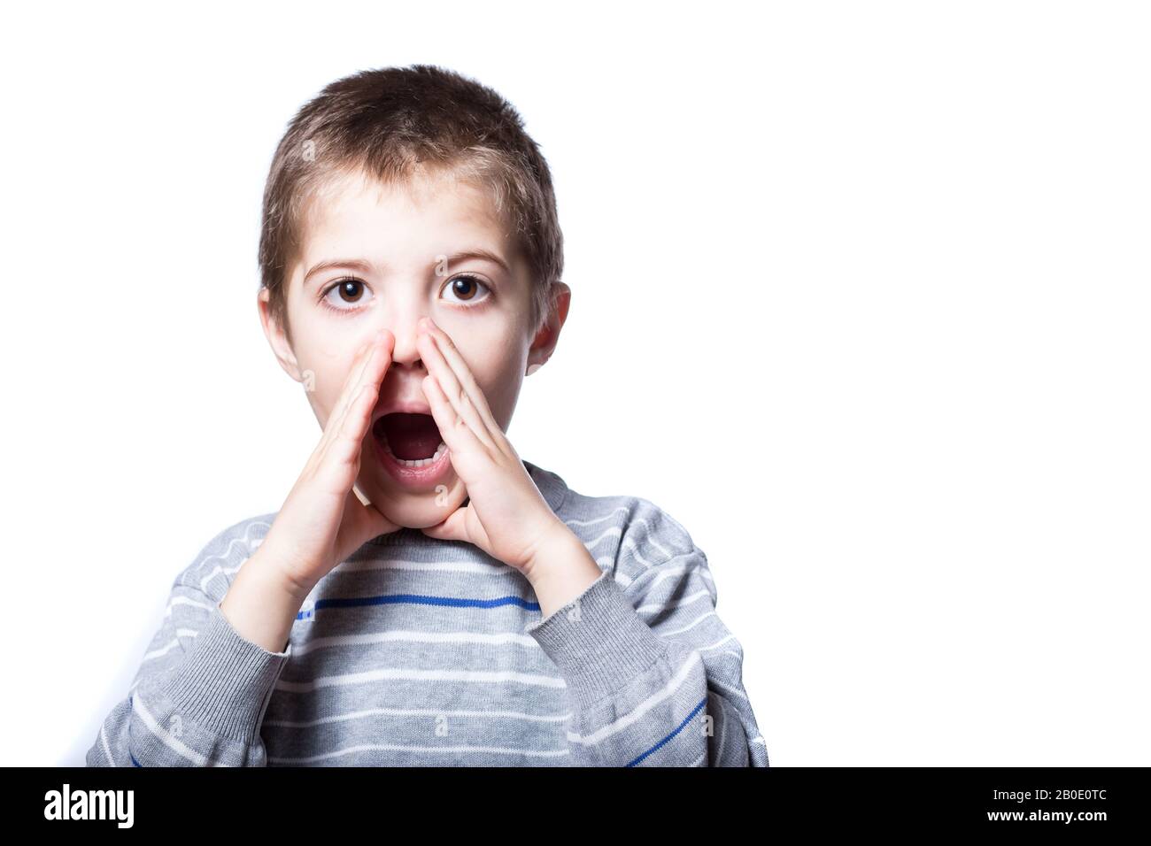 The boy is loudly calling for help. children scream out loud. Boy