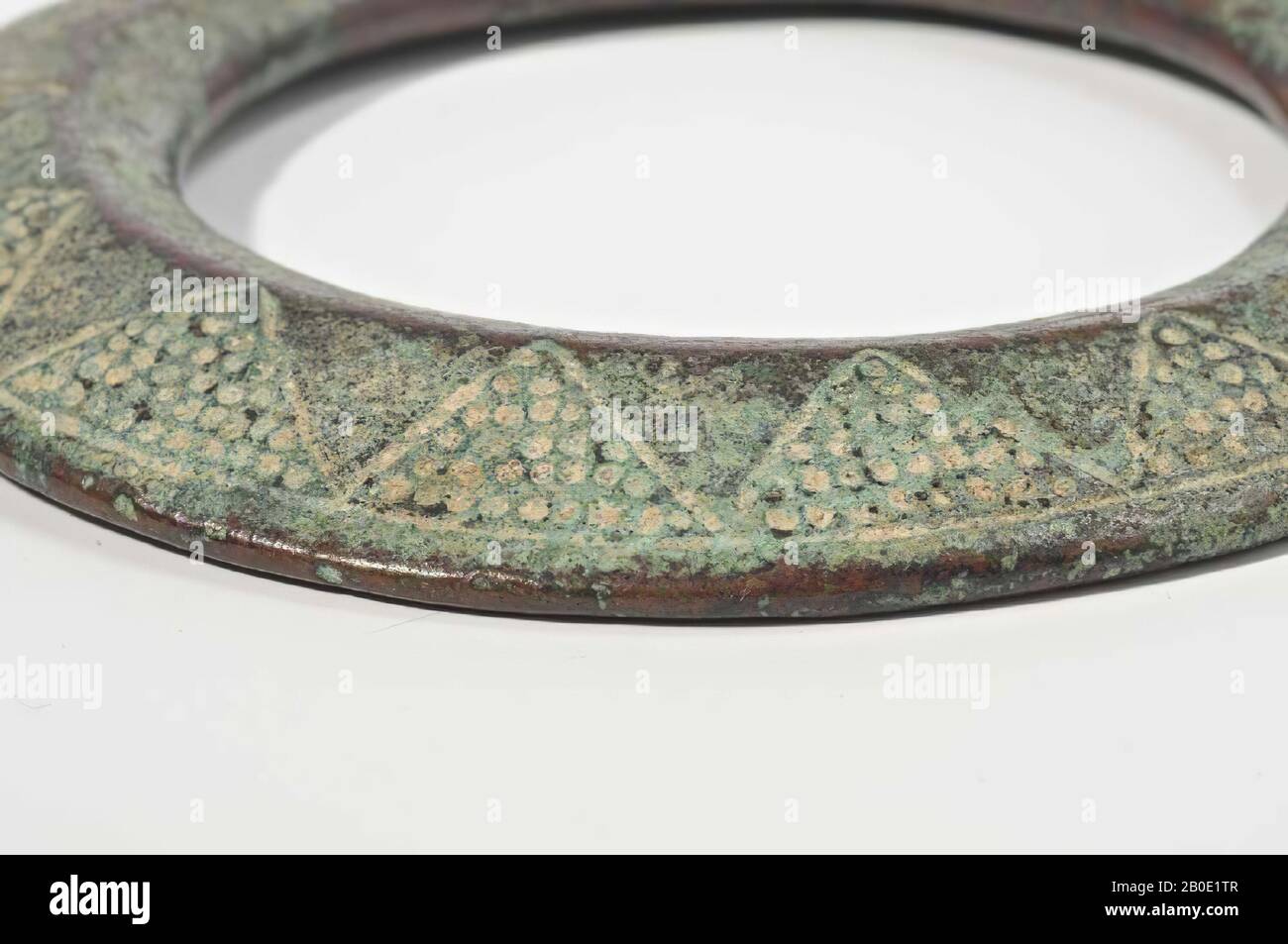 A bronze bridle ring decorated with 3-angular ornaments filled with dots, horse, metal, bronze, D 8.3 cm, Thickness 0.5 cm, Early Bronze Age III 2400-2000 BC, Iran Stock Photo