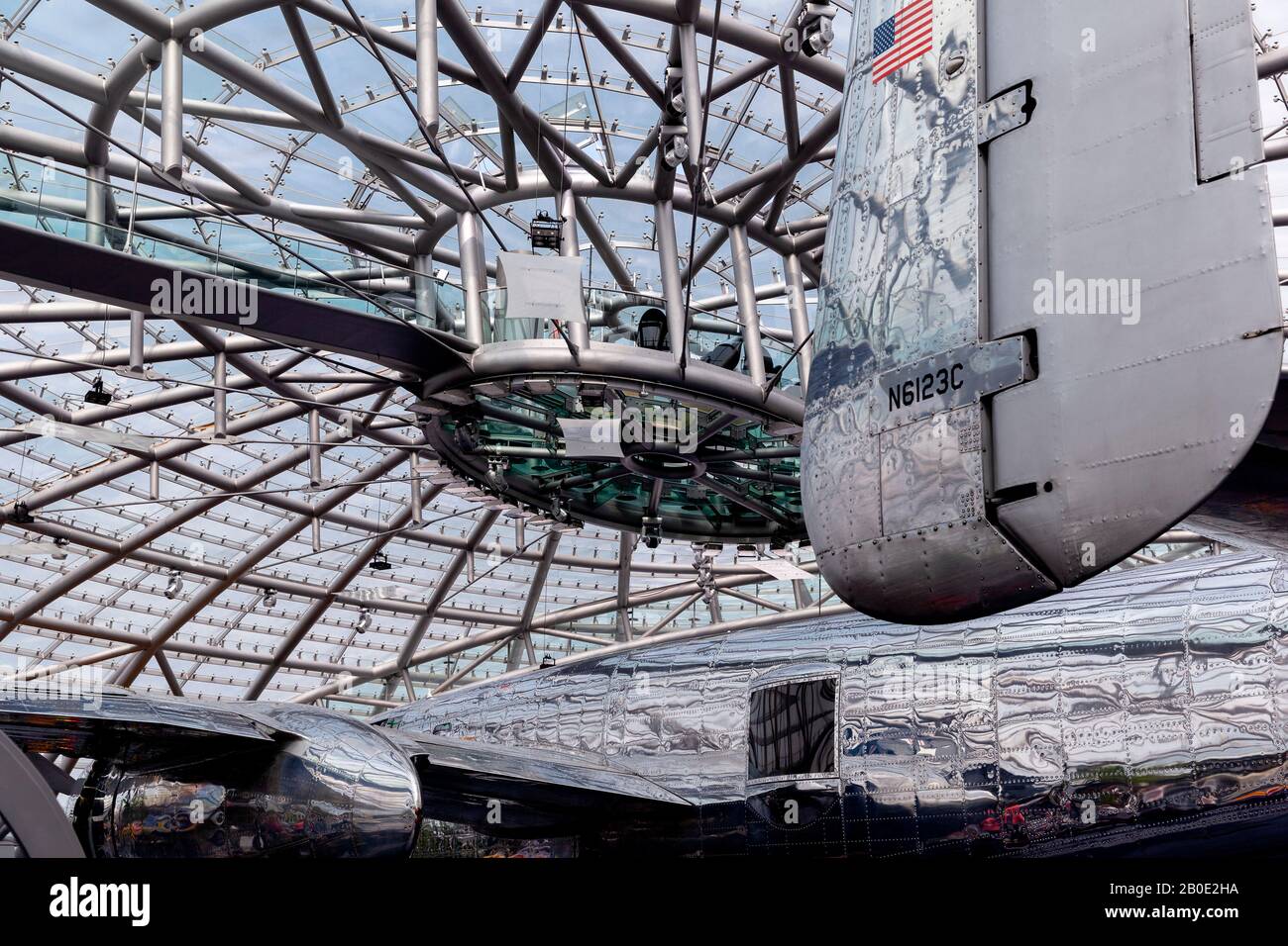 Salzburg / Austria - August 2019: Red Bull Hangar-7, a modern glass and steel building hosting a collection of historical airplanes, helicopters. Stock Photo