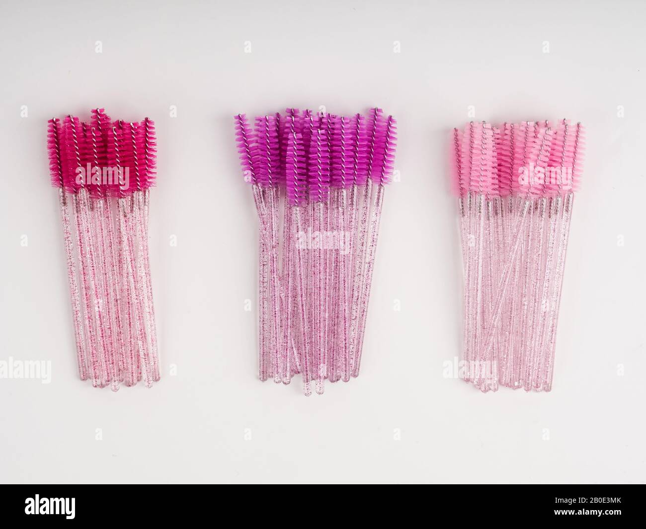 lots of eyelash brushes, tools for women's eyelash extensions. Stock Photo