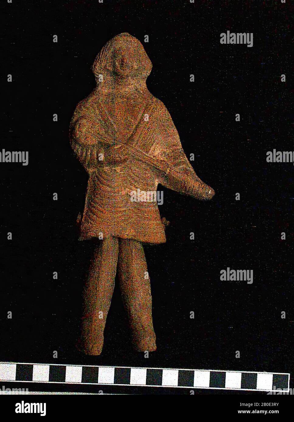 Parthian terracotta figure, representing a standing man who plays a lute. Loose legs already fastened to the bottom of the body with the aid of a cord. Brownish-orange clay, somewhat beige on surface. Figure and legs printed from different shapes and then joined together. At the back loopoor to hang the figure as ex voto. Nomad tunica and pants very pleated. Wreath in hair, earrings, shoes. Lute diagonally against body, sounding board at right shoulder, other end to side, outside left hip., Figurine, pottery, H 19.3, B 9 cm, Parthische Period 250 BC. - AD 224, Iran Stock Photo