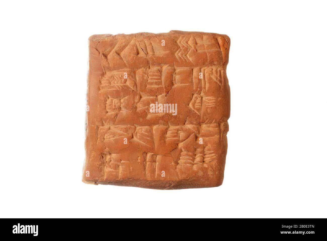 A clay tablet with a cuneiform inscription. The text is an acknowledgment of receipt for a residual quantity of barley as rental income for farmers., Inscription, pottery, clay, L 3.8 cm, B 3.6 cm, H 1.7 cm, Ur III Period 2112-2004 BC, Iraq Stock Photo