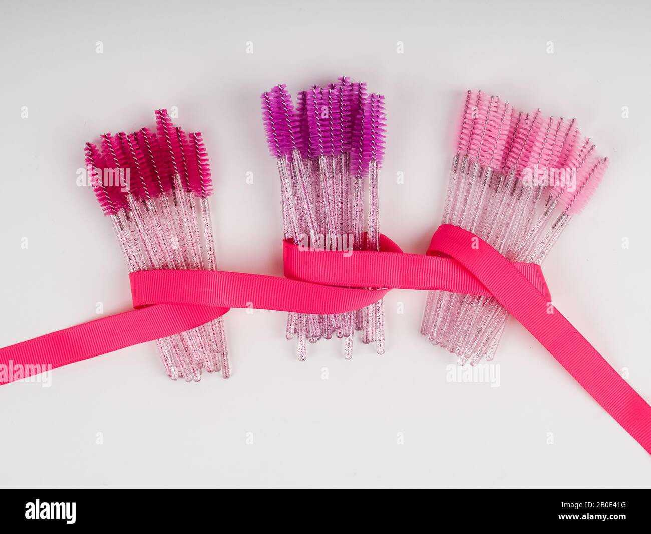 lots of eyelash brushes, tools for women's eyelash extensions. Stock Photo