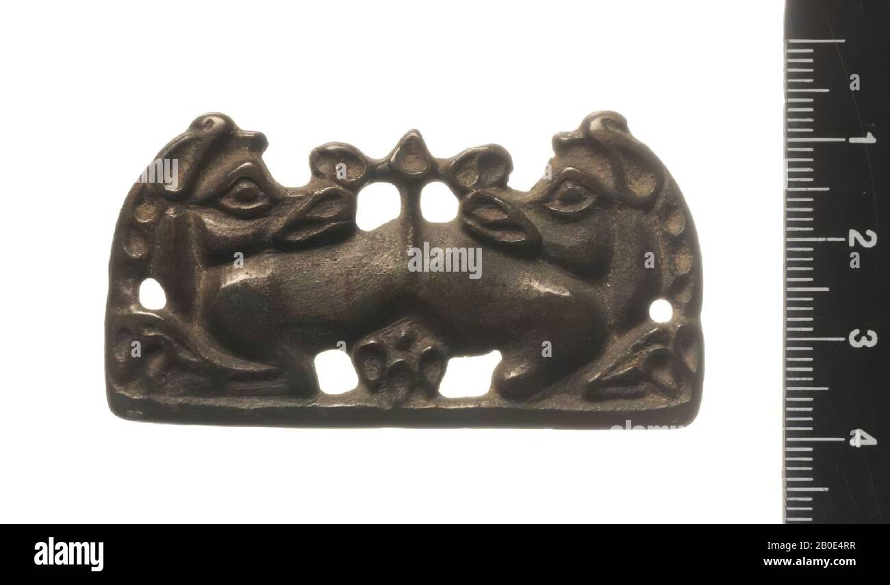 A bronze ornamental plate, à jour decorated representing the front bodies of two unknown animals., Varia, metal, bronze, H 3.3 cm, L 6 cm, Russia Stock Photo
