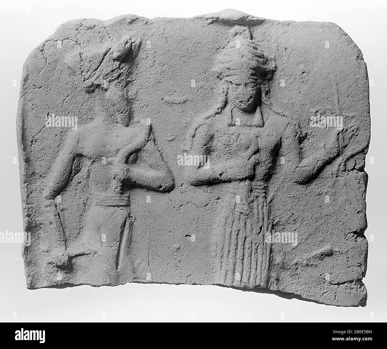 A plaque made in a mold. It shows a devotee who is taken by hand by the goddess Ishtar or led into the throne of the supreme god., Ornamental plate, pottery, clay, mold, L 5.4 cm, W 6.5 cm, Old Babylonian Period 1830-1531 v. Chr., Iraq Stock Photo