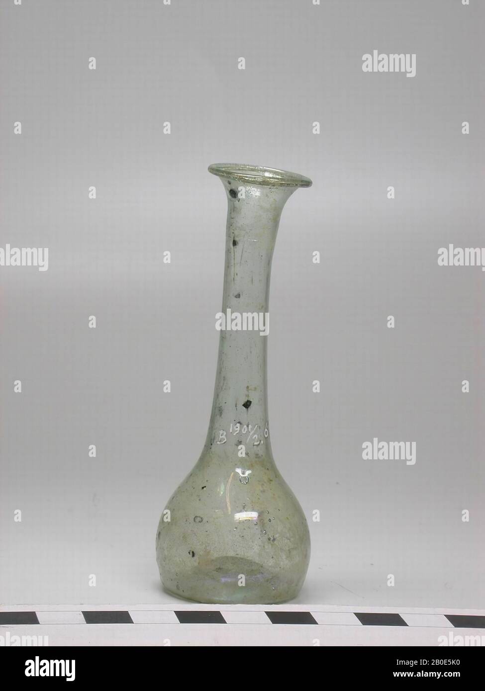 Spherical bottle of bluegreen glass with long neck, ending in funnel