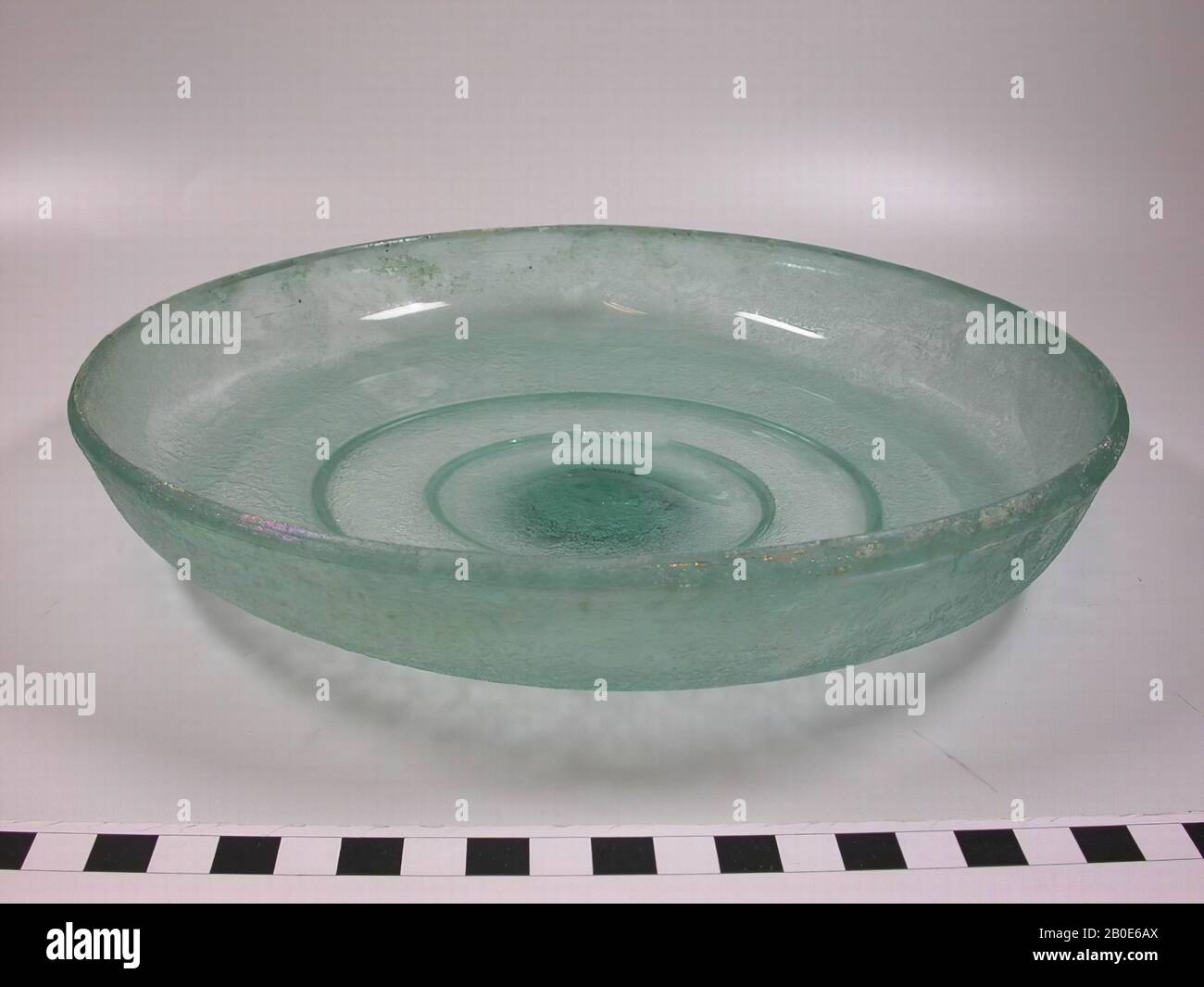 Light green dish with raised edge and very low foot., Crockery, glass, D 23.5 cm, Syria Stock Photo