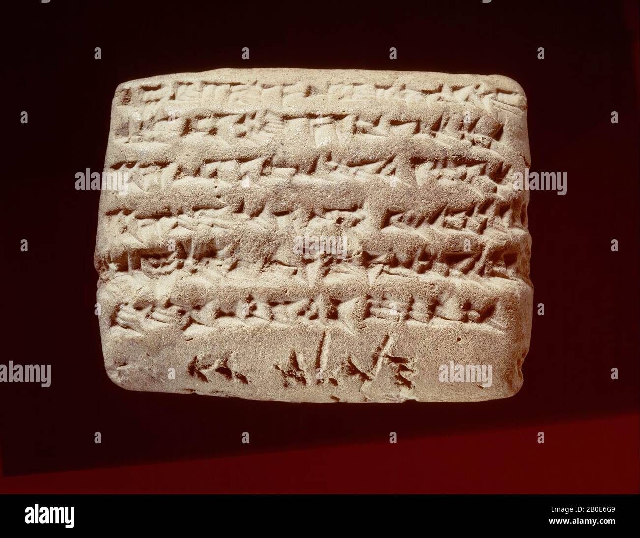 A clay tablet with a cuneiform inscription and an Aramaic caption. The text is a charter from Sippar with a claim of 15 shekels of silver, charged to a certain Bel-iddina son of Nabu-etir-napsjati, from the 29th year of King Darius king of Babylon and king of the countries (492 BC .). On the lower edge of the tablet is a caption, in cursive Aramaic writing engraved in the clay, with the words Van bel-iddina son of Napahai, that is, the name of the debtor. The gradual introduction of Aramaic as a language of speech and writing in Mesopotamia, from the 9th century BC, led, especially in Persian Stock Photo