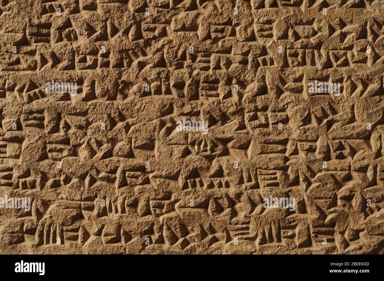 A stone tablet with a cuneiform inscription. It is an example of the so-called Mullissu inscription, several examples of which are known. The text is dedicated to Mullissu or the goddess Ninlil and told about the renovation of her temple by King Assurbanipal (669-627 BC) and the victory over the Elamites., Inscription, stone, limestone, L 43.5 cm, B 38 cm, H 2.5 cm (16 15 Stock Photo