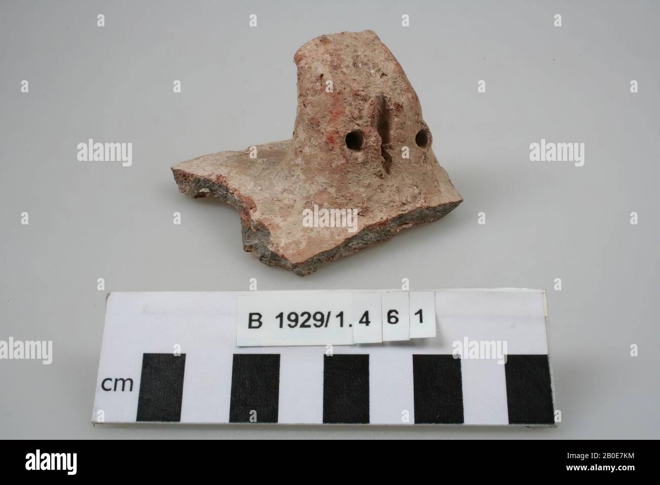 A fragment of an earpiece, marked with two dots and a line, tableware, earthenware, L 7.8 cm, Palestine Stock Photo