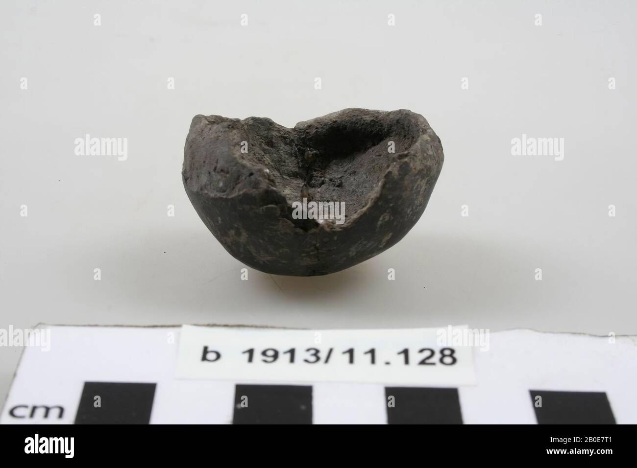 Rattle of hand-formed earthenware. Old bonding, the edge is damaged ...