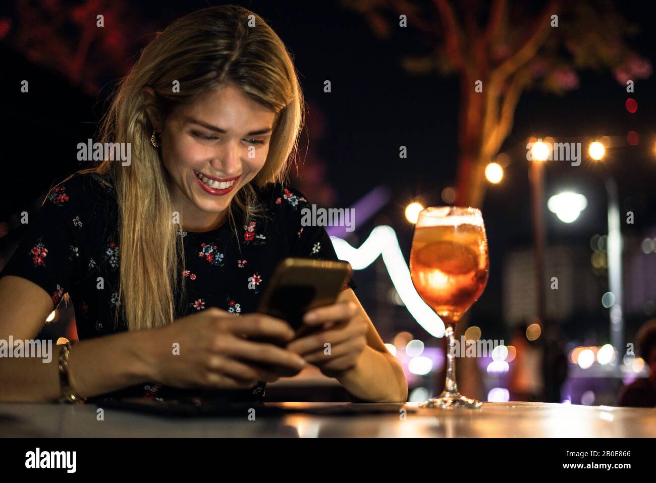 Young woman using smart phone Stock Photo