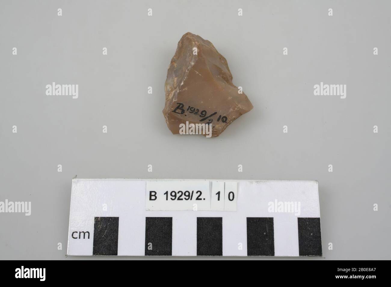 A flintstone exit, triangular in shape., Stone tool, stone, flint, L 4.3 cm, Palestine Stock Photo