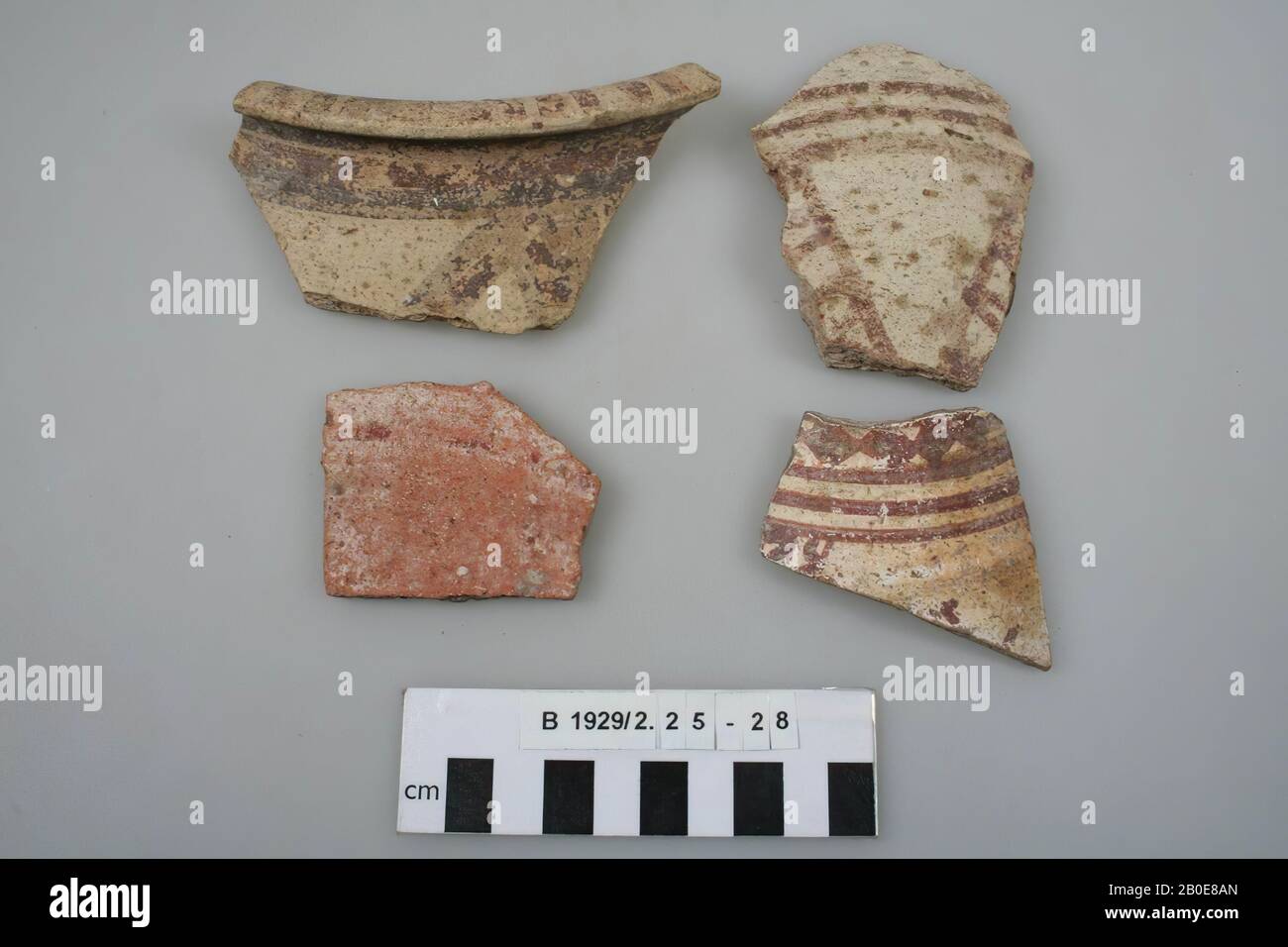 A border of a pot. The edge is flattened and pressed out during the production process. Both the top of the edge and the outer part of the wall are decorated with red and black paint., Crockery, earthenware, Late Bronze Age 1550-1200 BC, Palestine Stock Photo