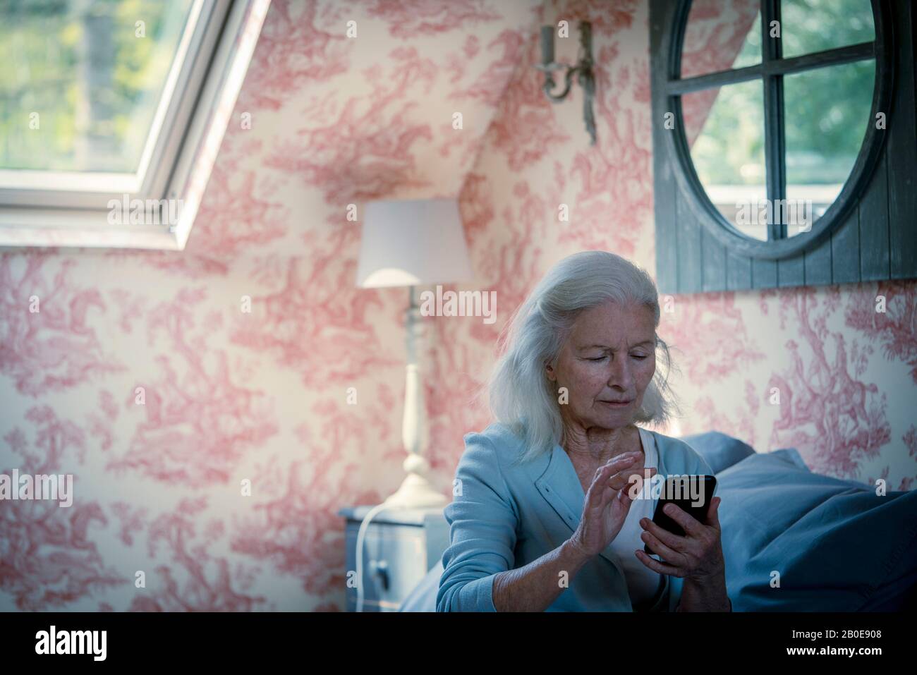 Senior woman using smart phone Stock Photo