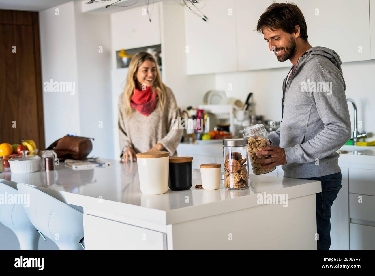 Couple standing in kitchen hi-res stock photography and images - Alamy