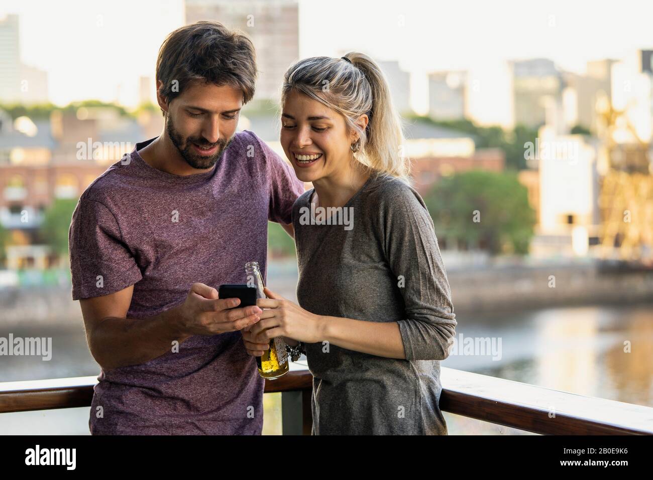 Young couple using smartphone Stock Photo