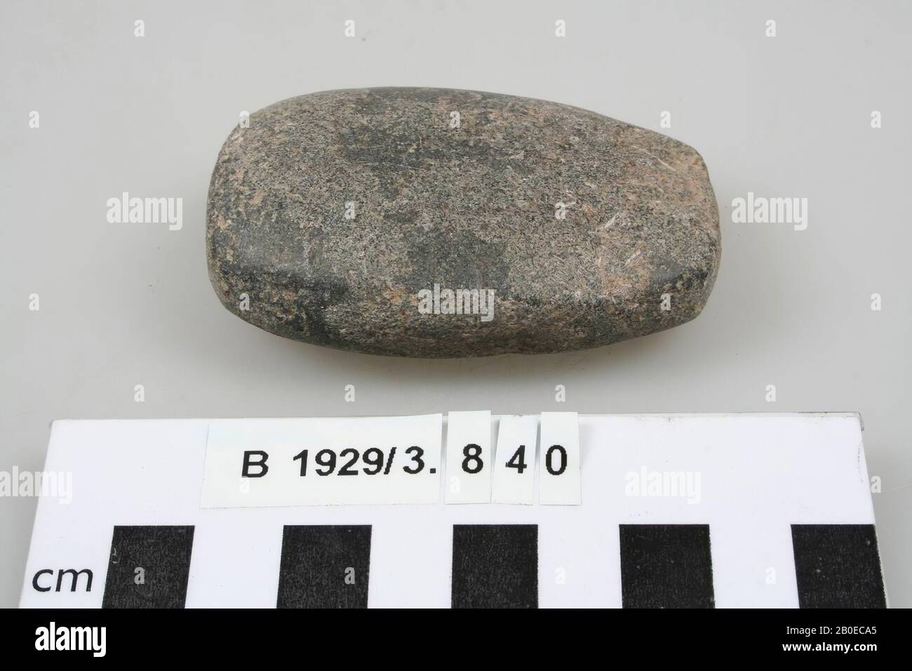 A rectangular stone with rounded corners, probably used as polishing ...