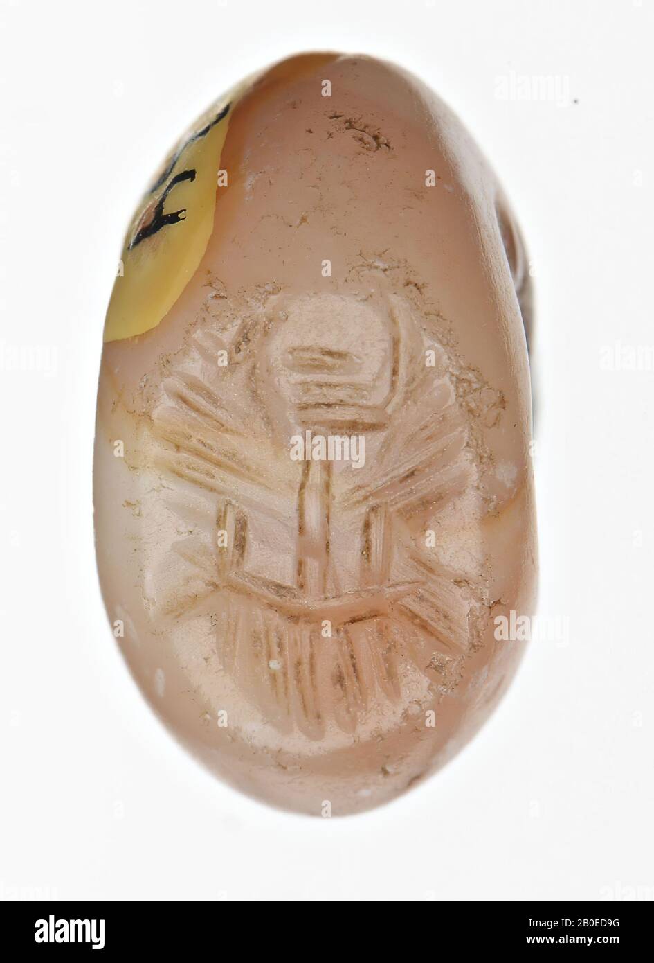 An ellipsoid stamp with an image of the face of a man with beard., Seal, stone, carnelian, D 1 cm, H 0.6 cm, D hole 0.4 cm, Iran Stock Photo