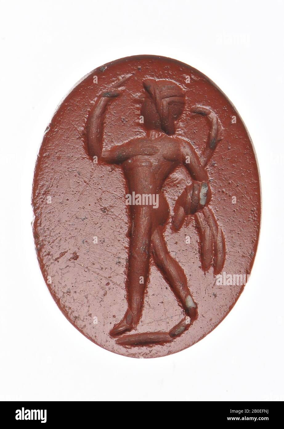 Dancing satyr in three-quarter rear view with head to the left. The left hand in surprise (aposkopein) raised to the head and in the right hand a pedum and nebris., Gem, intaglio, ringstone, stone, jasper, Color: red, opaque, Shape: oval, standing, Machined: Maaskant-Kleibrink, M ., Catalog of the engraved gems in the Royal Coin Cabinet, 1978, p.60, fig. 2, type F1, 9.5 x 7 mm. Thickness 2 mm., 1st - 3rd century after Chr. 1-300, Netherlands, Limburg, unknown, unknown Stock Photo