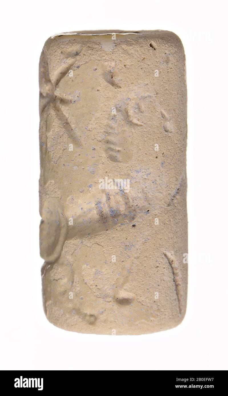 An earthen cylinder stamp with an image of animals and a tree, seal, pottery, H 2.1 cm, D 1 cm, Iran Stock Photo