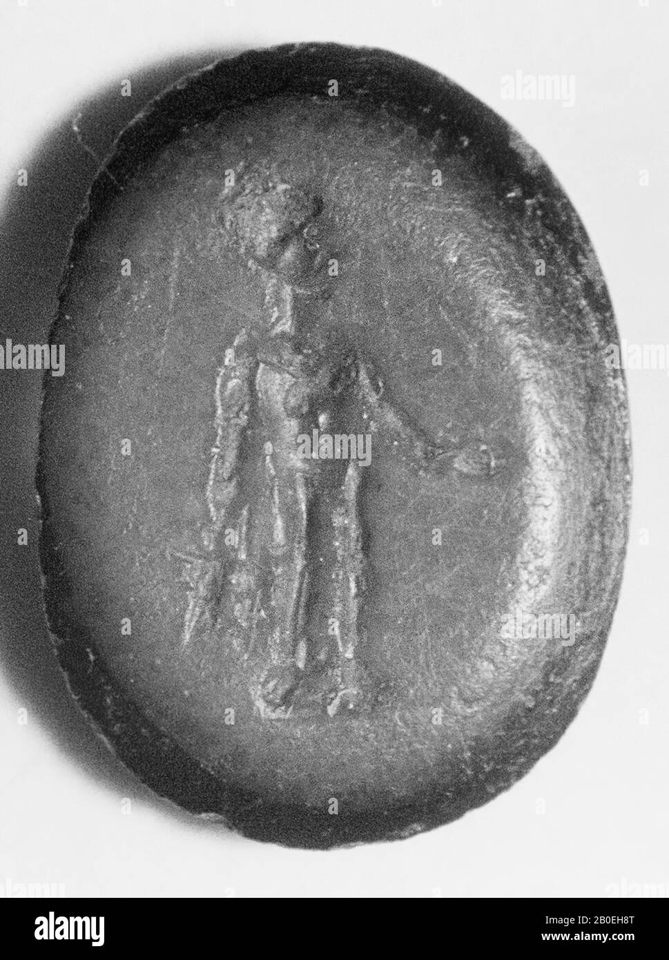 standing deity Bonus Eventus with two ears of corn in the right hand and offering dish in the left hand., Gem, intaglio, ringstone, stone, onyx, Color: black and blue, opaque, Shape: oval, standing, Machined: Maaskant-Kleibrink , M., Catalog of the engraved gems in the Royal Coin Cabinet, 1978, p.60, fig.2, type F4, 9.5 x 7 mm. Thickness 1,5 mm., 1st - 3rd century after Chr. 1-300, Netherlands, Limburg, unknown, unknown Stock Photo