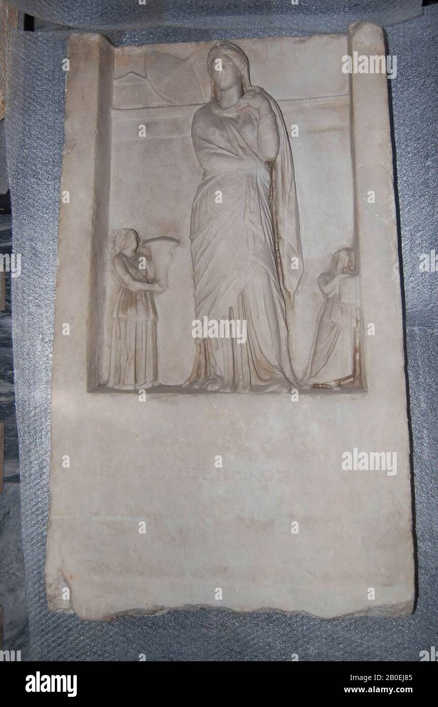 Eastern greek relief with standing woman, flanked by two small female dinners., Sculpture, grave relief, stone, marble, 94 cm, 144 kg, late-hellenistic -175 Stock Photo