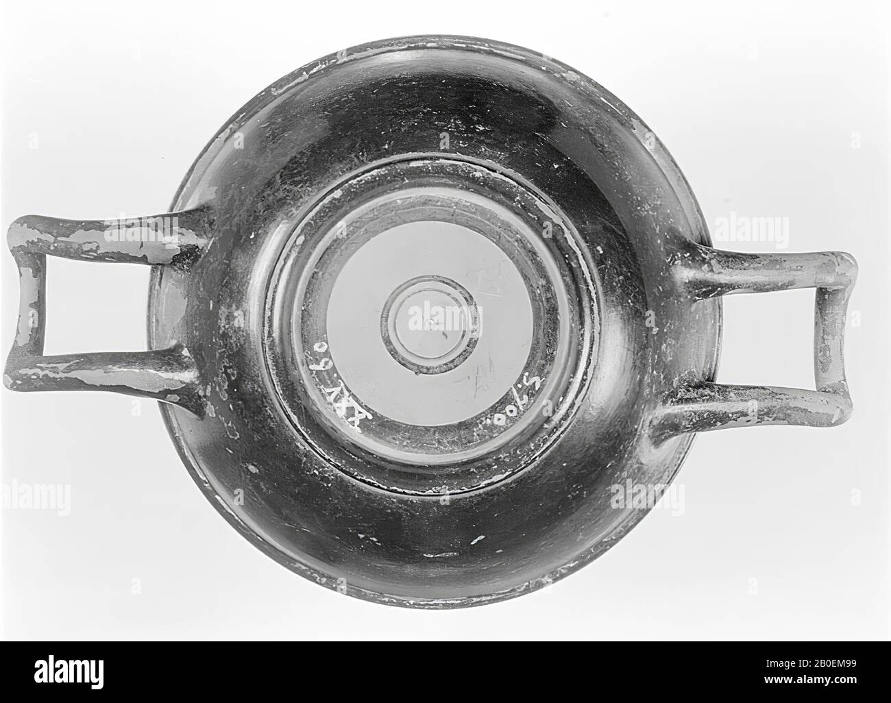 Attic black-glaze cup-skyphos. Stamped palmettes and ovules. Attic black-nested cup-skyphos. Inside a stamped decoration of a circle of ovolos and four palmettes in it., Vase, cup, skyphos, earthenware, black varnished, Attic, 5.8 cm, ø 12.6 cm, black varnished, Attic -400 Stock Photo