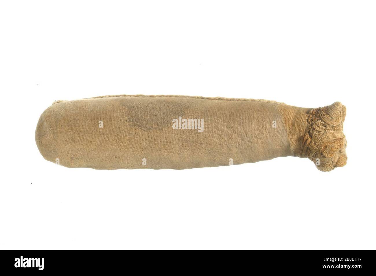 cat, Cat mummy with cylindrical body and naturalistic head. The animal's body has been wrapped in a single sheet or medium-fine linen (warp-faced tabby, about 13 x 32 threads Stock Photo