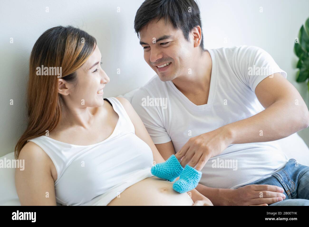 Pregnant Couple Of Husband And Wife Feels Love And Relax At Home Young Pregnant Couple Of Husband And Wife Feels Love And Relax At Home Young