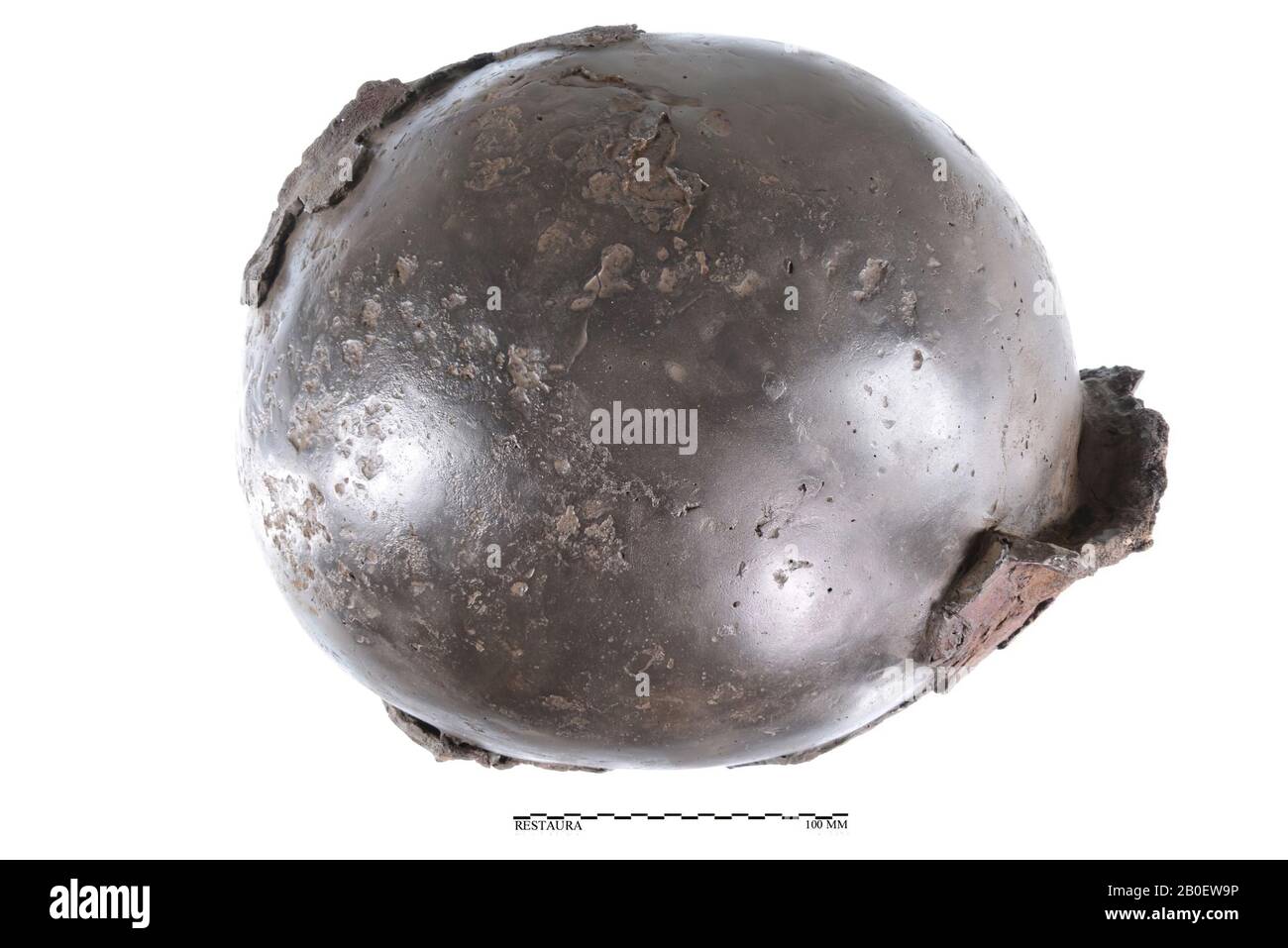 Inventory book 1941: 1. Part of an iron helmet. On the inside, remnants of a ring armor attached to it. 2. Iron fragment, partly on the outside around 1941 Stock Photo