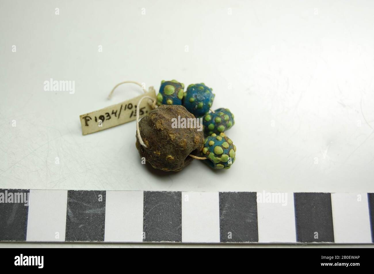 beads, Stringed string of 4 beads of turquoise glass with green nodules and 1 large, brown bead with yellow dots., Loose beads, glass, Third Intermediate Period, Egypt Stock Photo