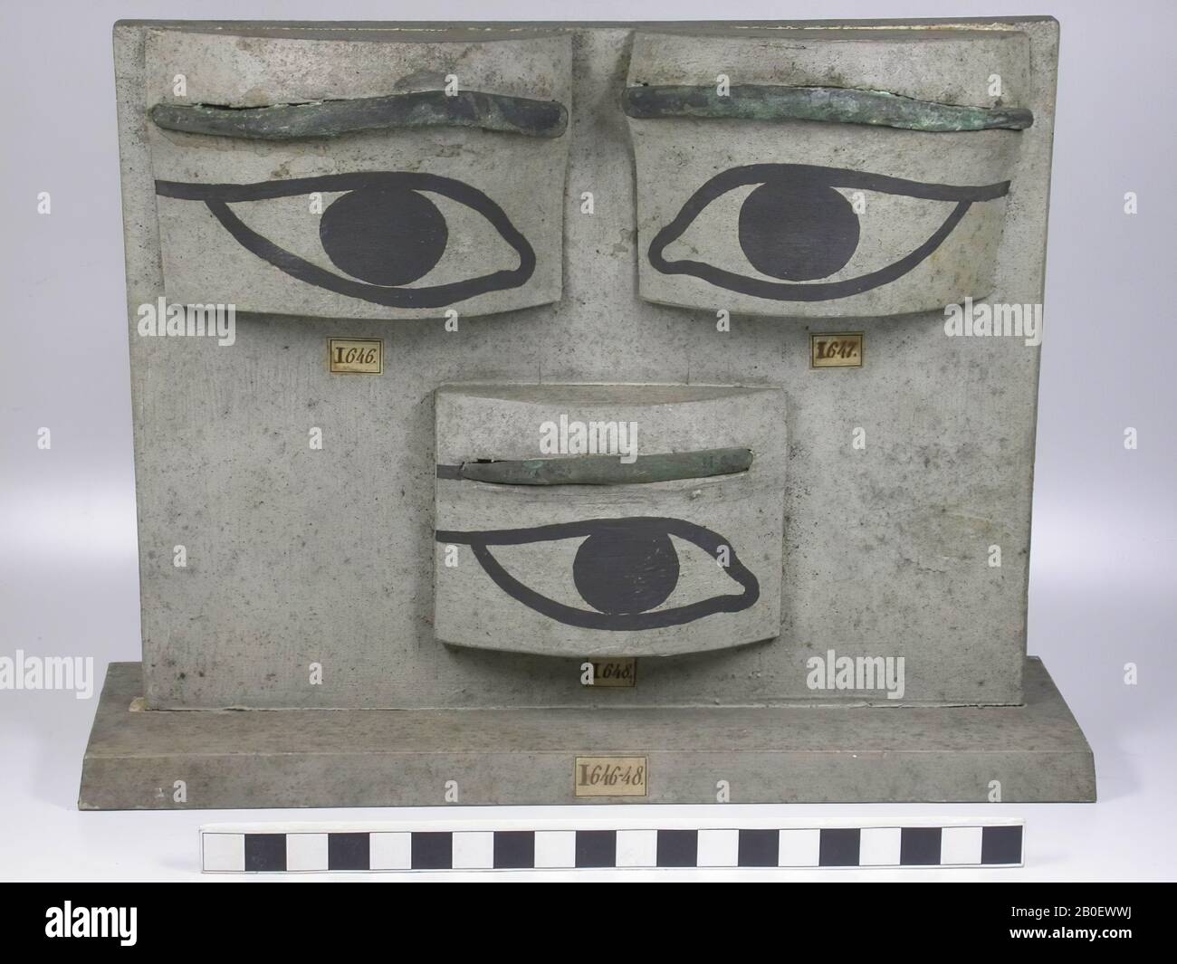 eyebrow, left, Mounted on a wooden panel, together with EC-ZM46 and EG-ZM48., Mummy box, fragment, bronze, Late Period, Egypt Stock Photo