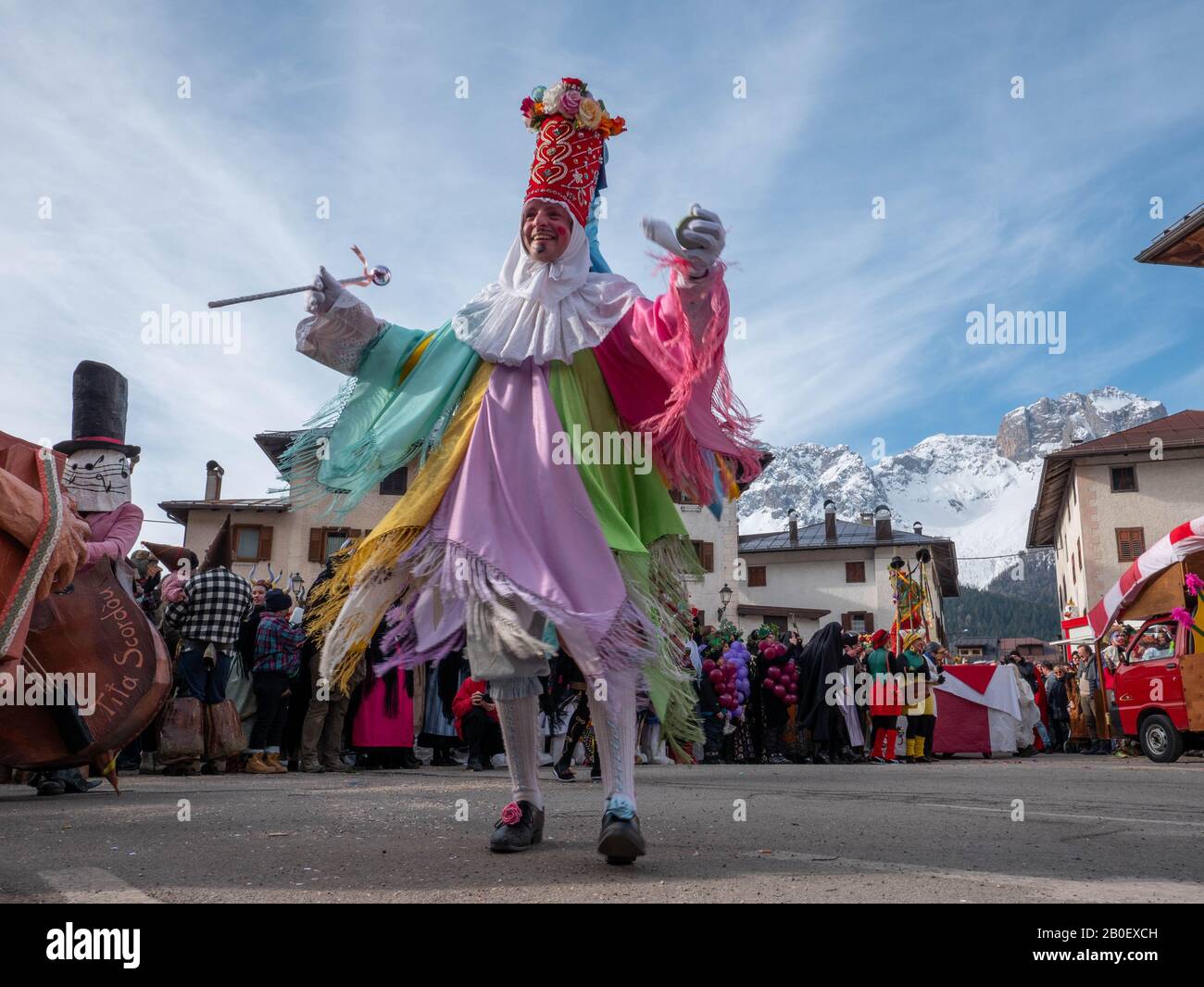 Matazin, the leader character dressed in a costume during the Carnival in  Dosoledo.Carnival in Dosoledo in Comelico is a blaze of colors, flowers,  wood masks and traditional figures Stock Photo - Alamy