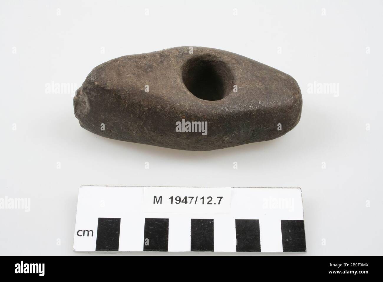 Polished stone ax with a round hole, ax, stone, 10,5 x 4,7 x 4 cm, Germany,  unknown, unknown, Heckenbeck Stock Photo - Alamy