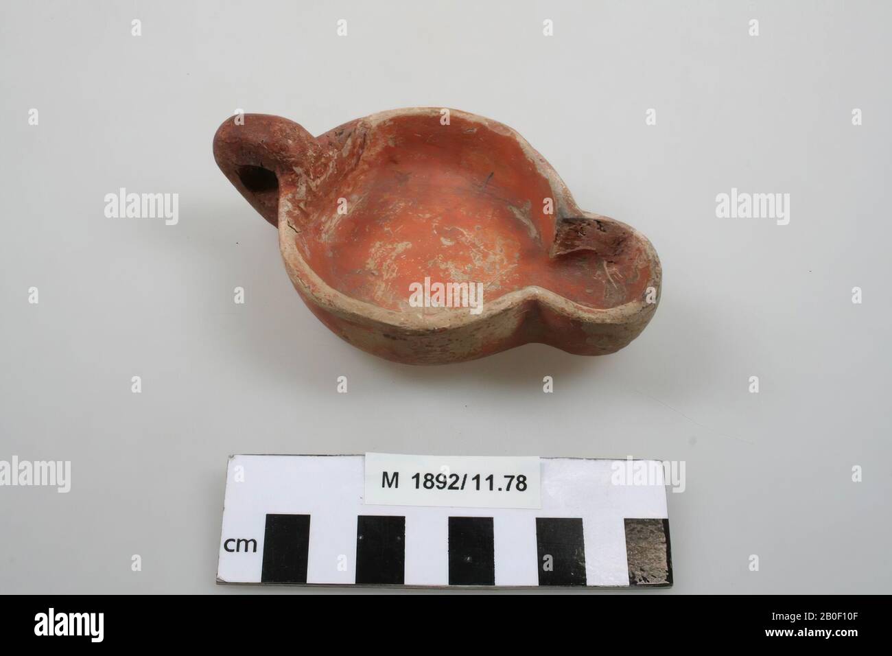 Oil lamp of earthenware with open top, with ear, spout. With brand: PPS. Addition to the ear, the side wall and the spout., Oil lamp, earthenware, 11,7 x 7,1 x 4 cm, roman, Germany, unknown, unknown, Xanten Stock Photo