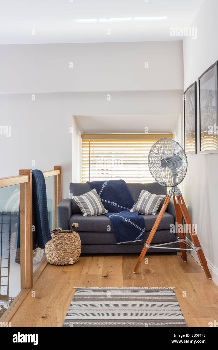 Sofa bed on mezzanine with nautical throw from Dunelm and basket Stock Photo