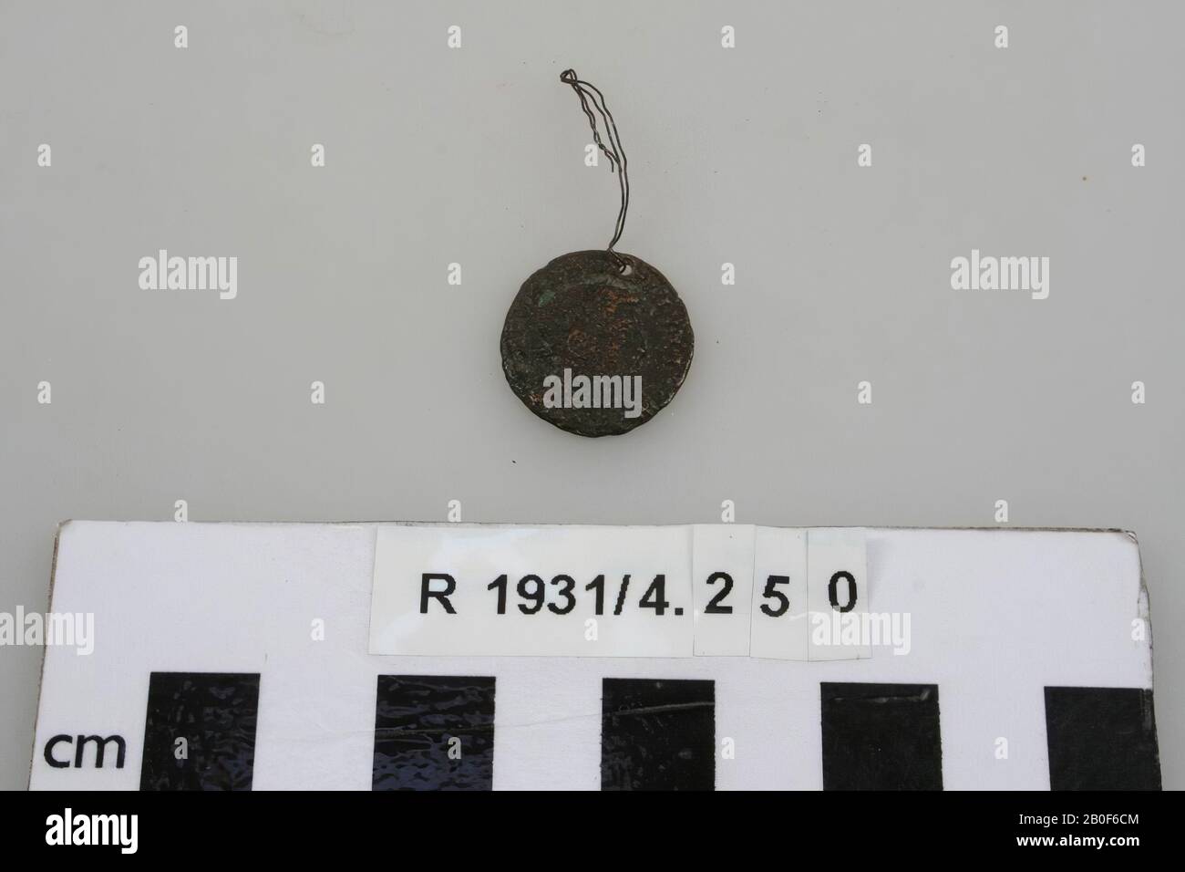 Bronze coin, pierced on the edge., Coin, metal, bronze, diam: 1,8 cm, France, unknown, unknown, unknown Stock Photo