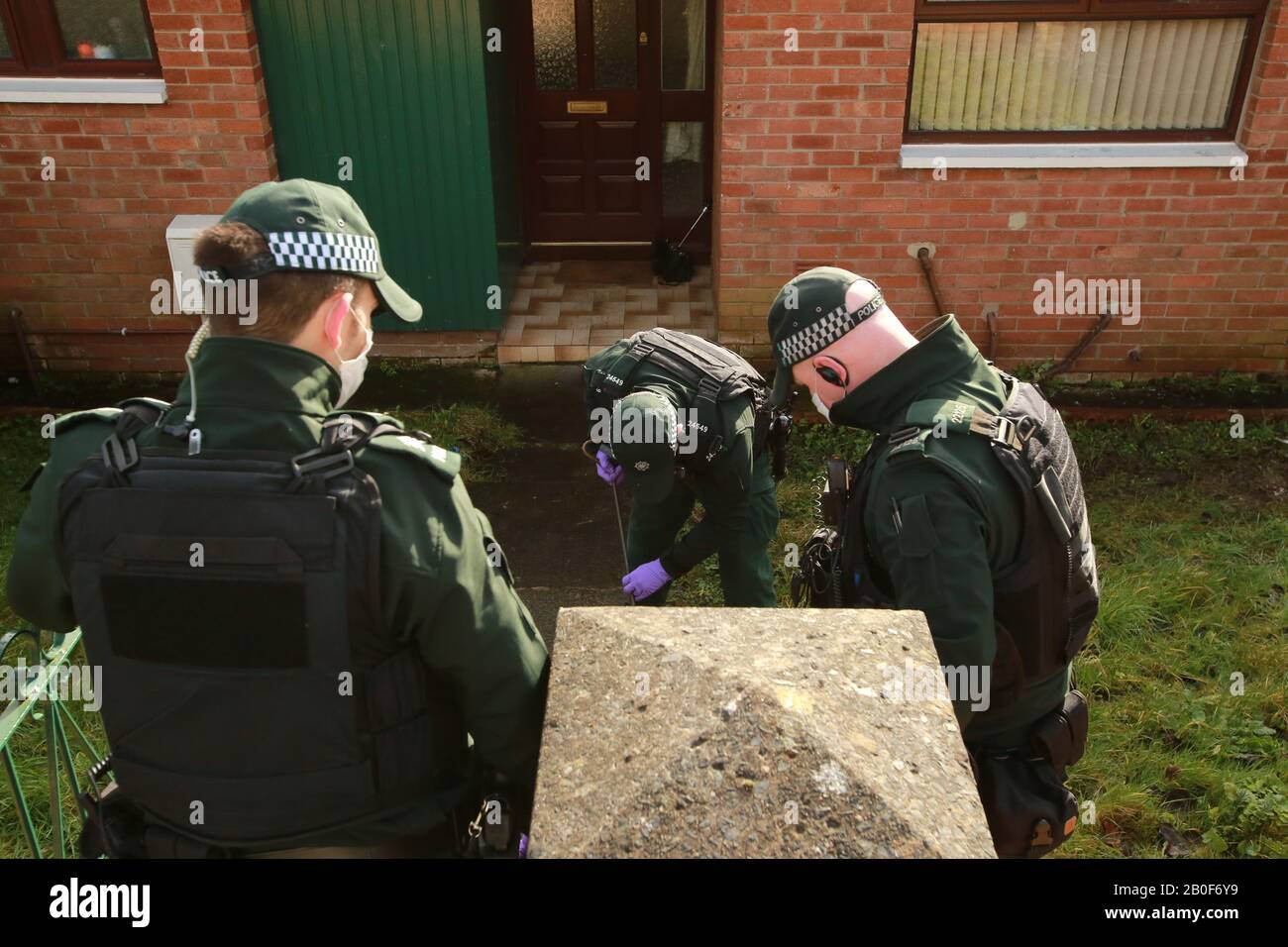 Belfast, Northern Ireland. 20th Feb 2020. PSNI Police carry out a search of the home of Martin Finucane, brother of the murdered solicitor Pat Finucane,  outside his home in Lenadoon. An explosive device was thrown at his west Belfast home in the early hours of Thursday morning. Martin is the Uncle of North Belfast Sinn Fein MP John Finucane. Credit: Irish Eye/Alamy Live News Stock Photo