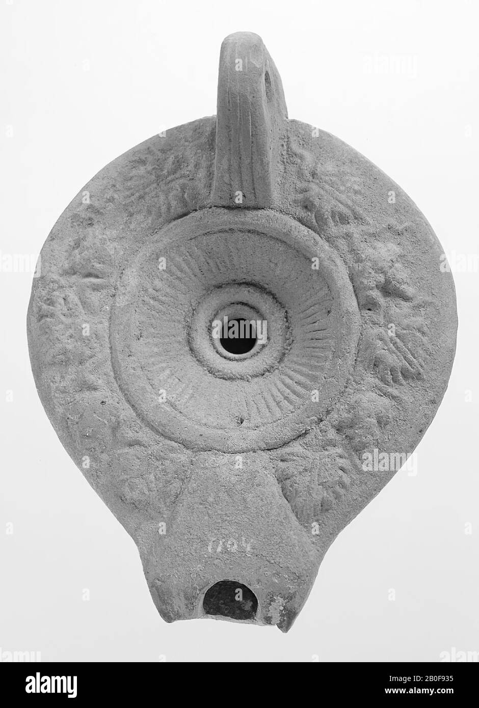 A Lamp Of White Earthenware With A Round Body The Round Hollow Mirror Is Surrounded By Concentric Circles And Decorated With A Stripe Pattern And Concentric Circles Around The Small Filling Hole