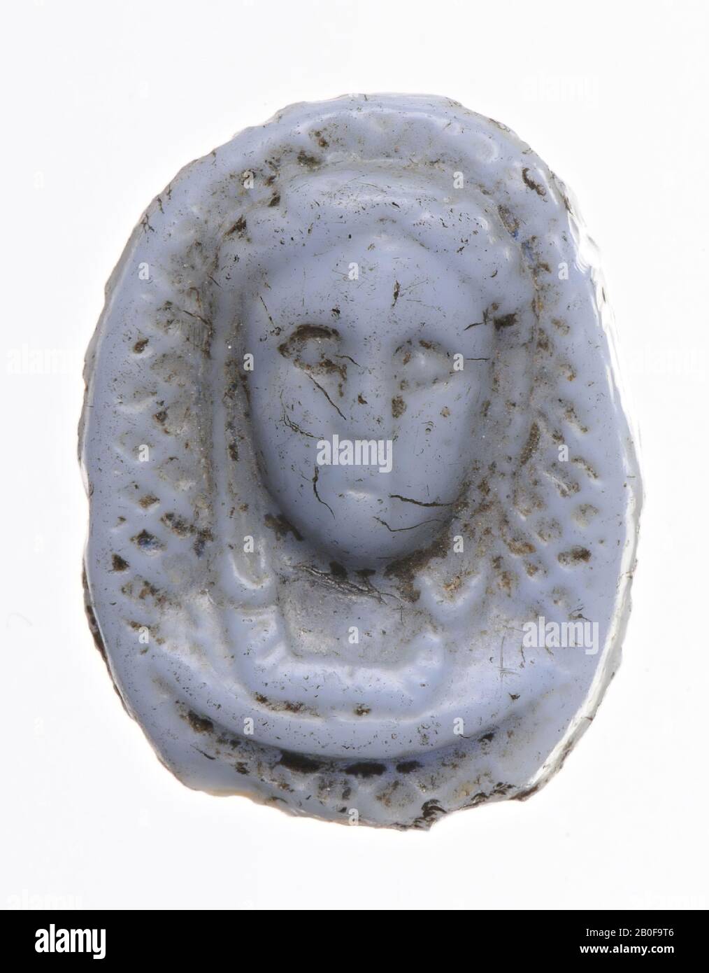 the woman has long hair and a necklace. Around her is the surface in cameo technique hatched., Cameo, glass, Color: light blue, opaque, Shape: oval, standing., 15 x 12 mm. Thickness 4 mm., Netherlands, unknown, unknown, unknown Stock Photo