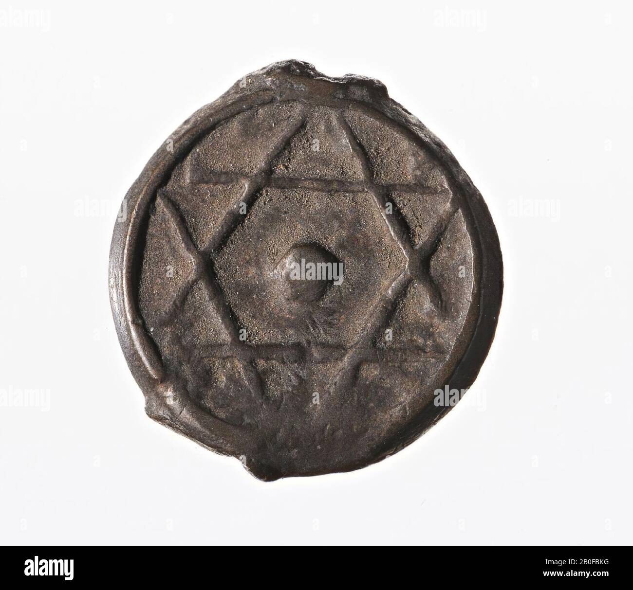 Bronze coin with on the front two intersecting equilateral triangles (Star of David), on the reverse side a name in Arabic and the year 1278 (ca. 1861 AD)., Coin, falus, Morocco, metal, bronze , nt ca. 1861, Morocco Stock Photo