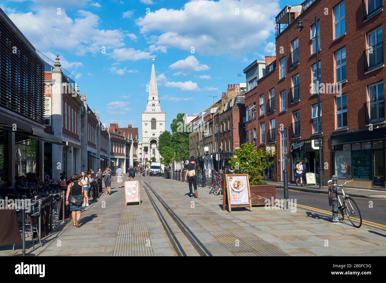 Spitalfields Market and Brushfield Street in East London, UK, with pedestrians Stock Photo